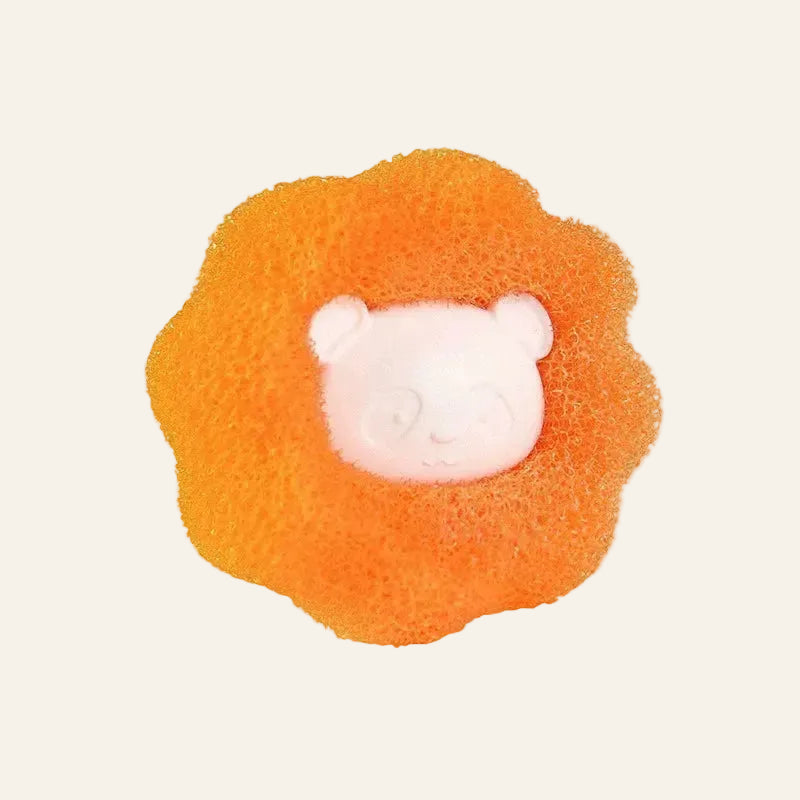 An orange textured sponge bath toy with a white molded panda face in the center, isolated on a white background.